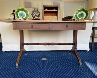 Vintage leather-topped writing desk. Measures 58" W x 38" D x 27" H. Photo 1 of 5. 