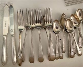 Assorted sterling and silver-plate place settings. Photo 1 of 2. 