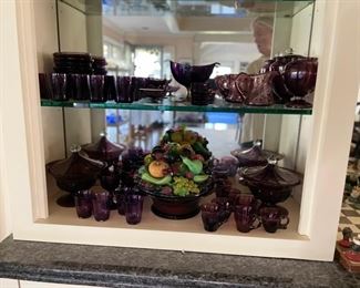 Large collection of amethyst glasses and serving pieces. 