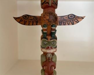 Miniature Alaskan carved wood totem pole. 