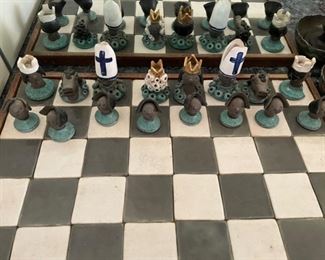 Chess board with clay, hand-made Mexican pieces. Photo 2 of 2. 