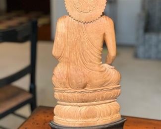 Hand-carved wood Buddha figurine on stand. Measures 17" H. Photo 2 of 3. 