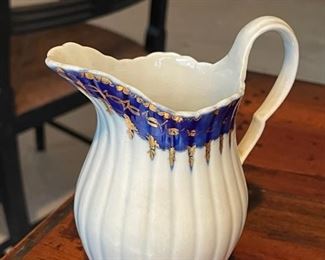 Small porcelain pitcher. Photo 1 of 2. 