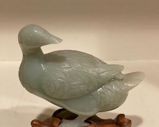 Carved jade duck on teak stand. 
