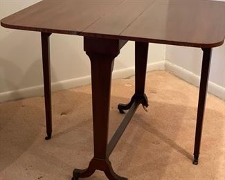 Vintage drop-leaf table.  Needs repair. Broken foot included. Photo 1 of 2. 