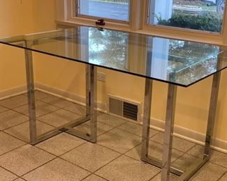 Vintage glass and chrome dining table. Measures 54" W x 36" D x 29" H. Photo 1 of 2. 