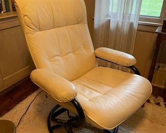 White Eames-style chair and ottoman. (Lighting in room distorts true color. See next photo). Photo 1 of 2. 