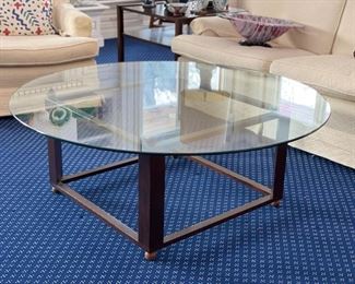 Glass and metal round cocktail table. Measures 4'D. The base measures 27" x 27" x 18.5" H. Photo 1 of 2. 