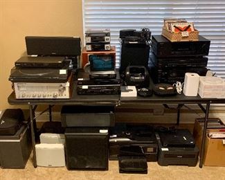 Just a sample of some of the electronics including Stereo systems, DVD players, record player, speakers, projectors, and printers