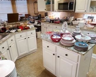 Kitchen full of  dishware, cookware, and small kitchen appliances