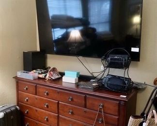 Matching dresser, “ 65 inch television, and handbags