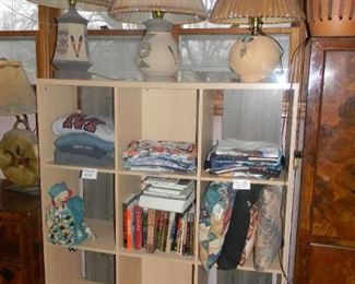 many lamps / books / SCRUBS on a rolling storage
