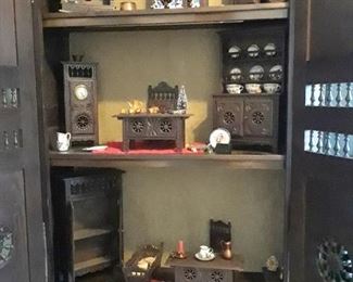 Miniature furniture in French cabinet. From Breton, France. The collection and the cabinet will be sold as a unit. Replica of the cabinet is show with doors open lower left.