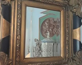 One of two mirrors with ornate frames. 14" x 16" - a great size to include in a grouping for a dramatic accent.