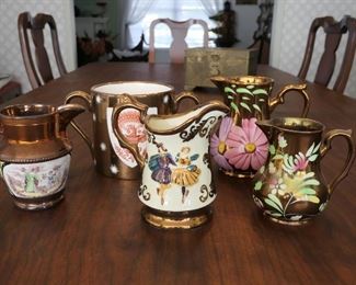 Example of Wade copper lustrer ware  collection. English.  Larger size cream pitchers shown.