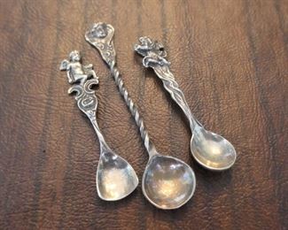 Three salt spoons with cherub design