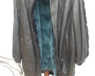 Beautiful leather jacket lined with sheared mink dyed blue. Size large.