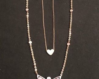 14k and diamond necklace and 10k tiny gold heart necklace.