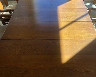 Reduced $600! Classic early American dining table- 44" extendable 93". Six wooden chairs with arms, two upholstery chairs. Can coordinate delivery for a fee. 