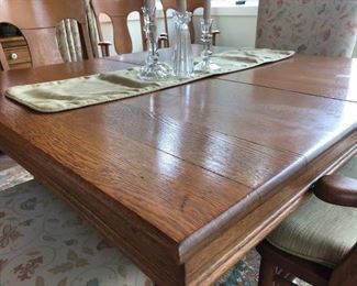 Reduced $600! Classic early American dining table- 44" extendable 93". Six wooden chairs with arms, two upholstery chairs. Can coordinate delivery for a fee. 