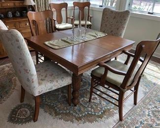 Reduced $600! Classic early American dining table- 44" extendable 93". Six wooden chairs with arms, two upholstery chairs. Can coordinate delivery for a fee. 