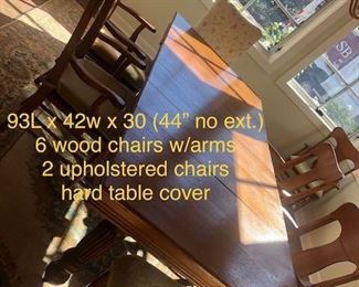 Reduced $600! Classic early American dining table- 44" extendable 93". Six wooden chairs with arms, two upholstery chairs. Can coordinate delivery for a fee. 