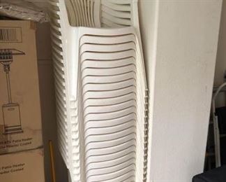 24 plastic chairs & 12 green/white cushions $200