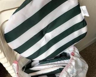 24 plastic chairs & 12 green/white cushions $200