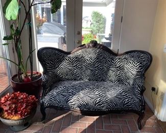 Zebra pattern loveseat $1200. Baroque sofa style of Napoleon III (Second French Empire) has a beautiful black zebra printed fabric on the backrest. The structure is in beech and lacquered glossy black. The seat is very comfortable and soft, and the wood is finely hand carved by a craftsmen.
Perfect for a refined interior and also for a hairdressing salon, restaurant, entertainment. 64x32x40 high in the back. 
Shipping and delivery available please enquire. 