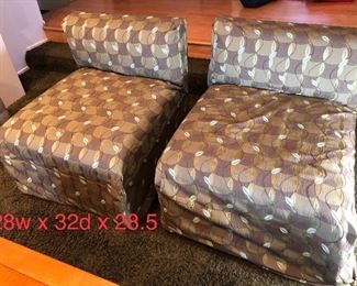 Two armless lounge chairs cream with green leaf pattern slip covers. Minor marks. Good condition.  $125 each, $200 both. Delivery available. No pets, no smoking.