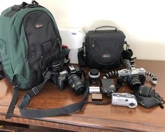 Camera bundle (will not separate). Canon EOS650, Canon FTb, canon lenses 35-105, 35-105 FD, 50mm FD, Asanuma 28mm. Speedlite 300EZ. Sony 3.3mp Cybershot. 2 x Lowepro bags. Misc items battery, lens covers etc. $250