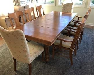 Reduced $600! Classic early American dining table- 44" extendable 93". Six wooden chairs with arms, two upholstery chairs. Can coordinate delivery for a fee. 