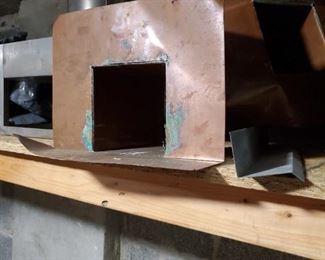 Roofing copper scuppers through wall