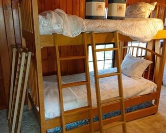 Solid wood bunk beds. Can be split onto 2 singles. Also 2 trundles. 4 sleeping spaces altogether!