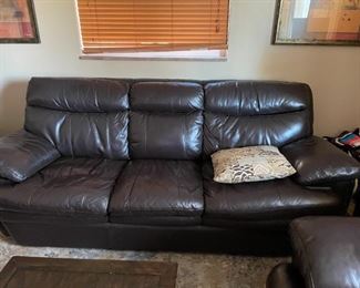 . . . with matching leather sofa