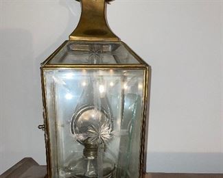 One of two antique oil lamps
