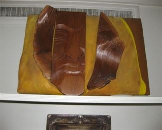 Wood carved face on fabric artist: D. Stringer 13 "1/2 x 19"1/2 d x 6'8" h $200.
