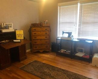 wide shot of room w antique Singer sewing machine