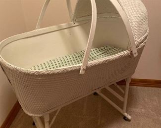 126 Wicker Bassinet And Baby Clothes