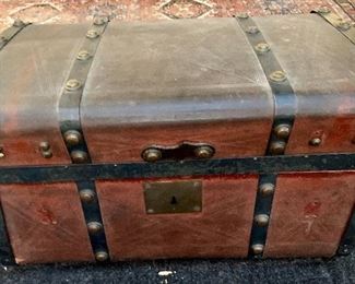 #19- Small antique Jenny Lind style trunk- leather covered- 24w x 13t x 13 1/2d- $120