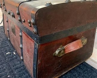 #19- Small antique Jenny Lind style trunk- leather covered- 24w x 13t x 13 1/2d- $120