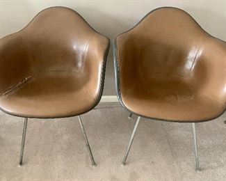#68- 2 early Eames Herman Miller fiberglass shell chairs covered in leather- $600 for pair