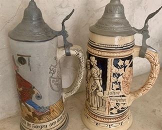 #32- 2 German steins- 10 1/2 inches tall- $40