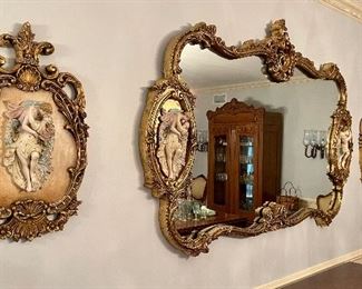 Antique heavy ornate gilt trim mirror with side decorations