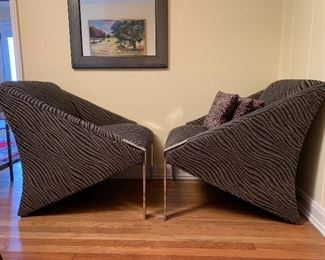 Pair of Andrée Putman (1925- 2013) post modern upholstered chrome lounge chairs include cheetah print footrests.  
