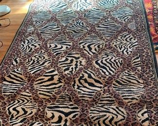 Animal print living room rug, machine made  measures approx 8' x 5'