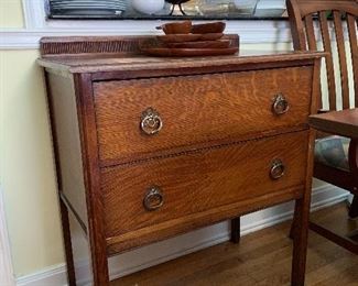 Antique petite oak dresser 2 drawer chest with decorative back.  Measures 3 ft at greatest height measures 30" across and 16.5 depth 