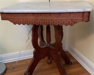 White marble topped Eastlake (Victorian) table measures 29" tall and 29" across and 20" deep