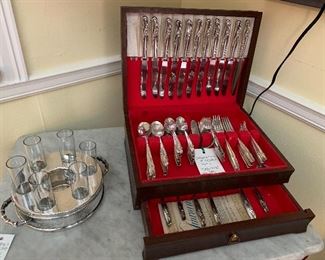 Silverplate shot set with markings  and International silver silverplate flatware set with box. 