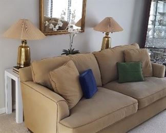  tan upholstered Love seat and sofa